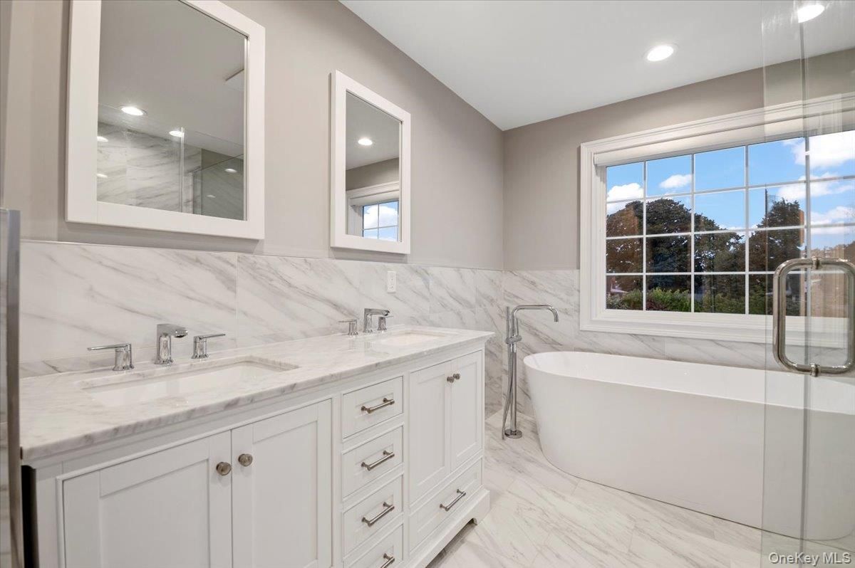 Bathroom, Dual Sink Vanities, Free Standing Baths, Glass Shower, Interior, Marble, Marble Walls, Recessed Lighting