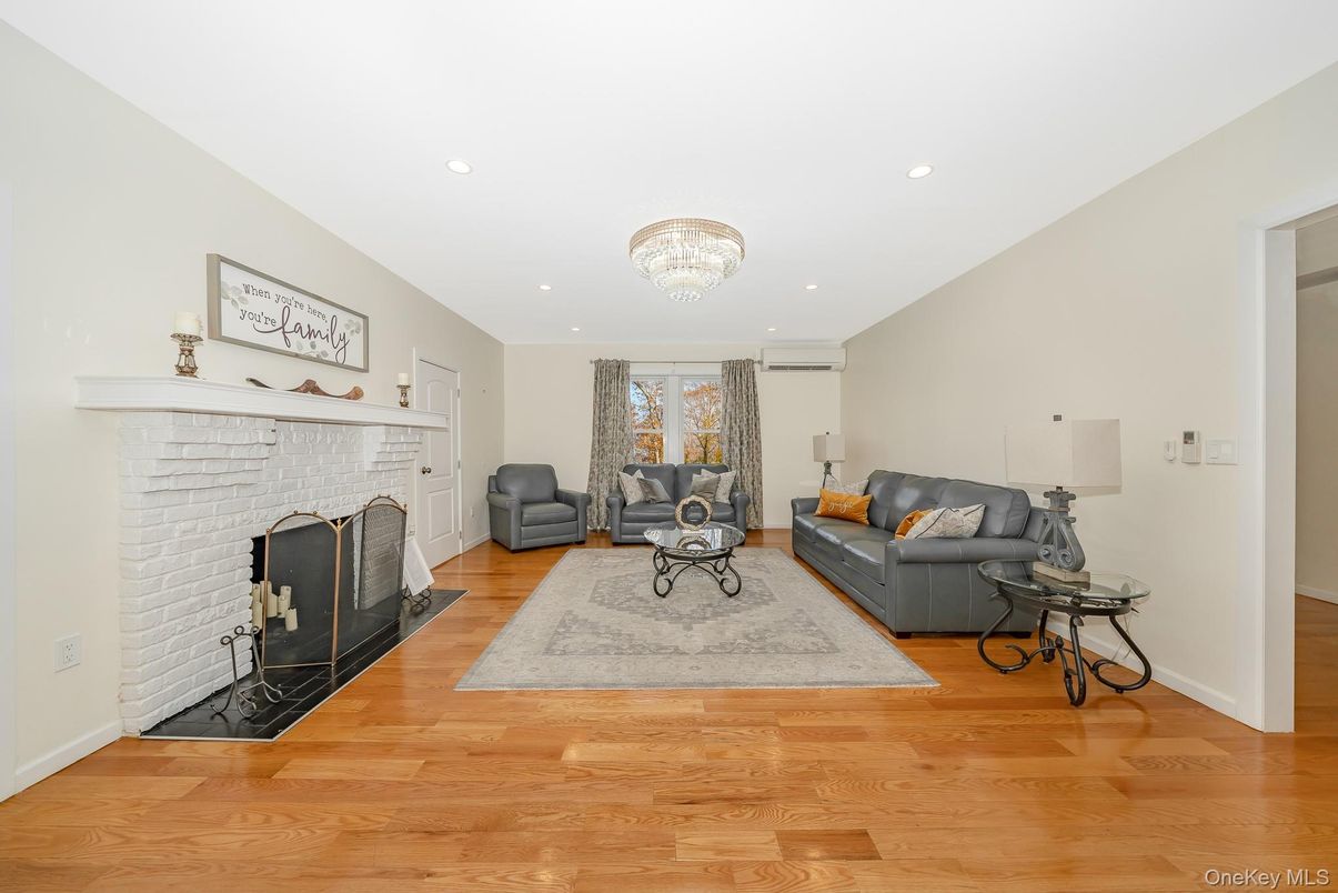 Chandelier, Fireplace, Interior, Living room, Recessed Lighting, Wood Texture Flooring