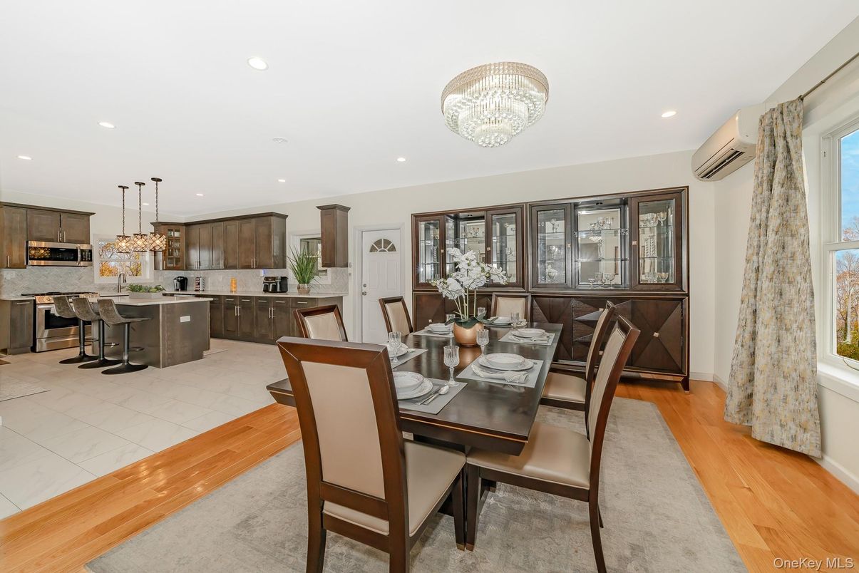 Chandelier, Dining room, Interior, Kitchen, Pendant Lights, Recessed Lighting, Stainless Steel Appliances, Wood Texture Flooring