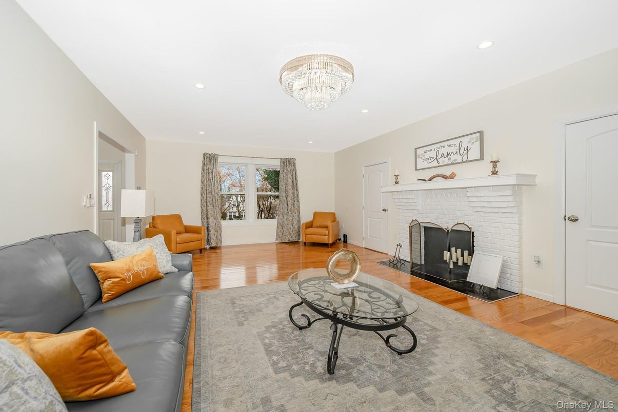 Chandelier, Fireplace, Interior, Living room, Recessed Lighting, Wood Texture Flooring