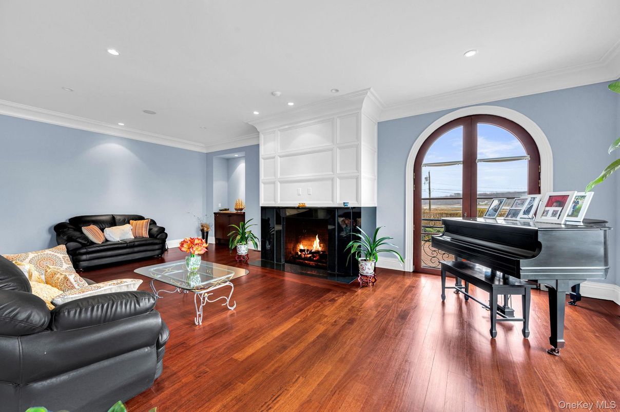 Fireplace, Interior, Living room, Piano, Recessed Lighting, Wood Texture Flooring