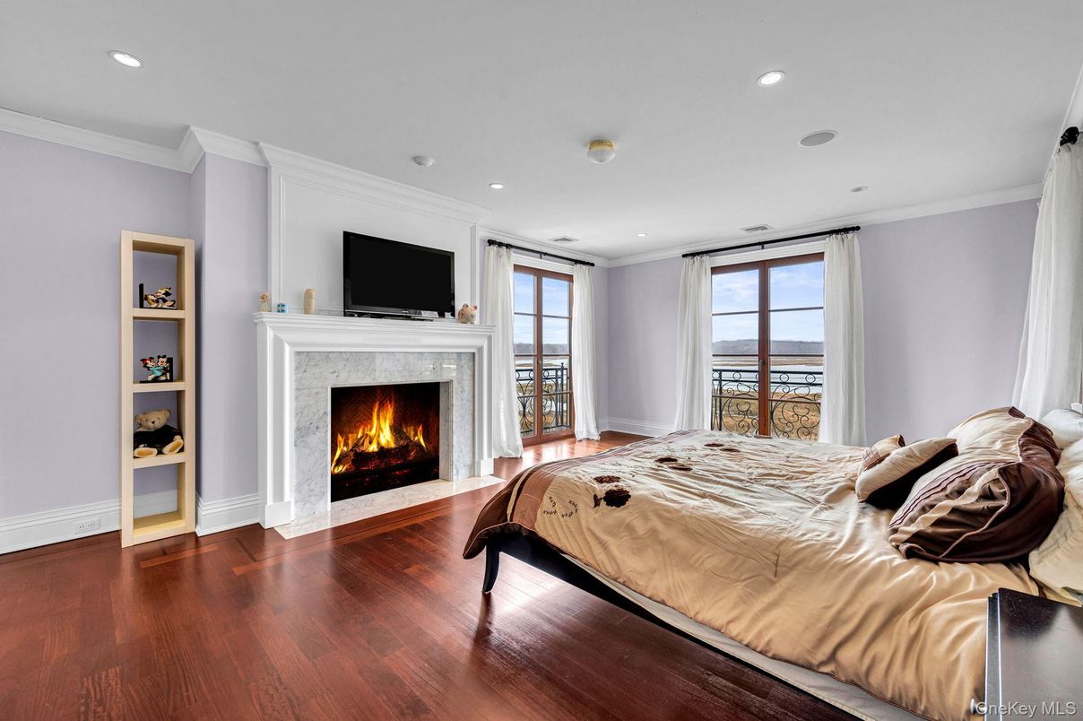 Bedroom, Fireplace, Interior, Recessed Lighting, Water, Wood Texture Flooring