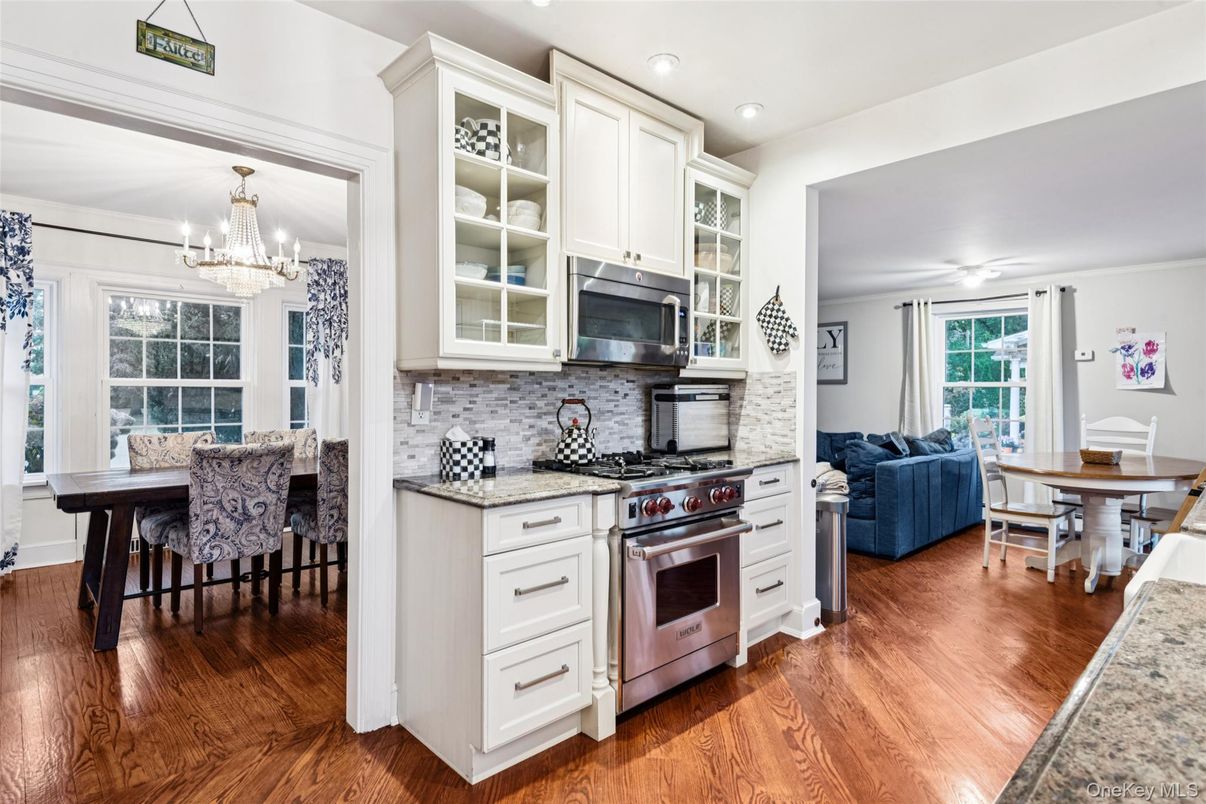 Chandelier, Dining room, Interior, Kitchen, Living room, Recessed Lighting, Stainless Steel Appliances, Wood Texture Flooring