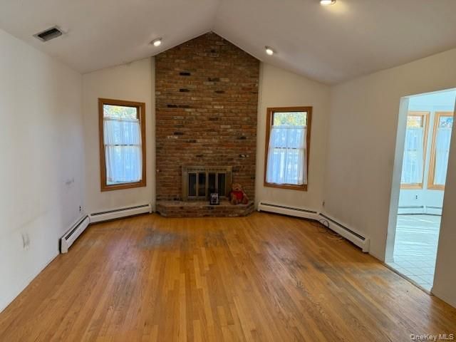 Empty room, Fireplace, Interior, Recessed Lighting, Stone Walls, Wood Texture Flooring