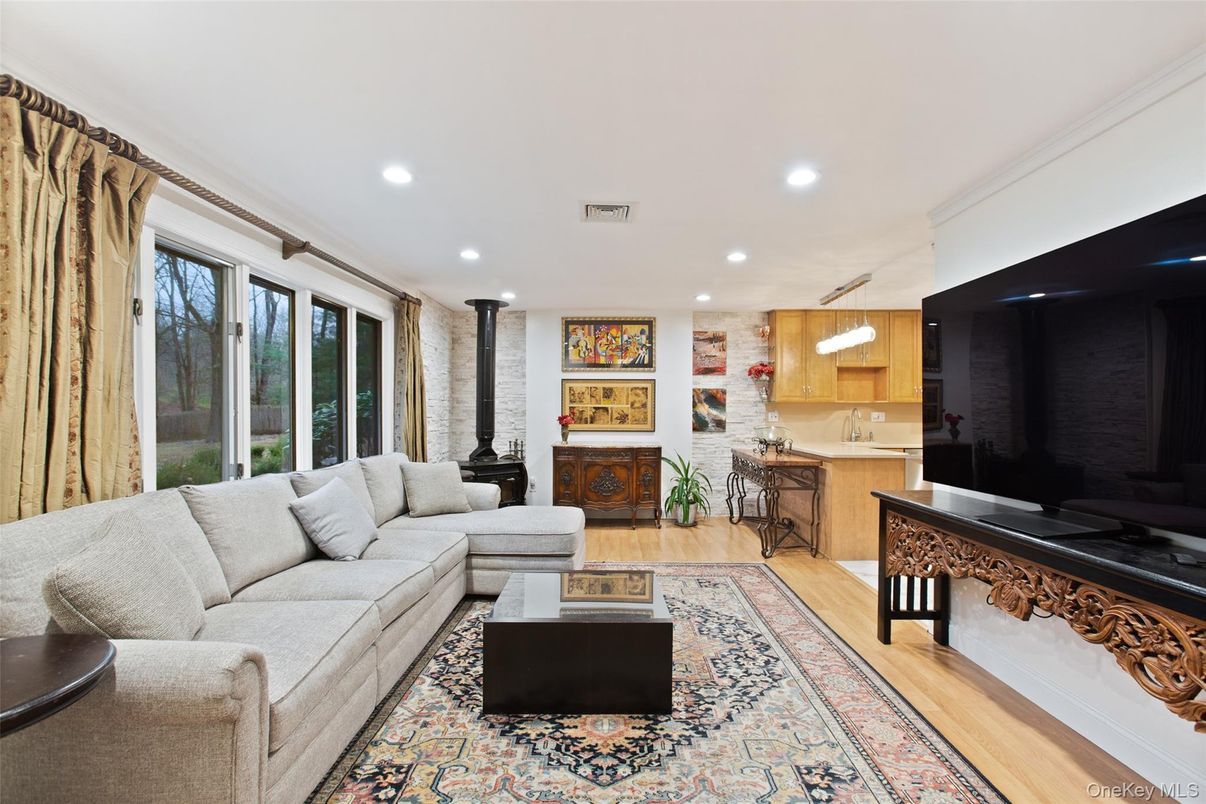 Fireplace, Interior, Kitchen, Living room, Recessed Lighting, Stone Walls, Wood Texture Flooring