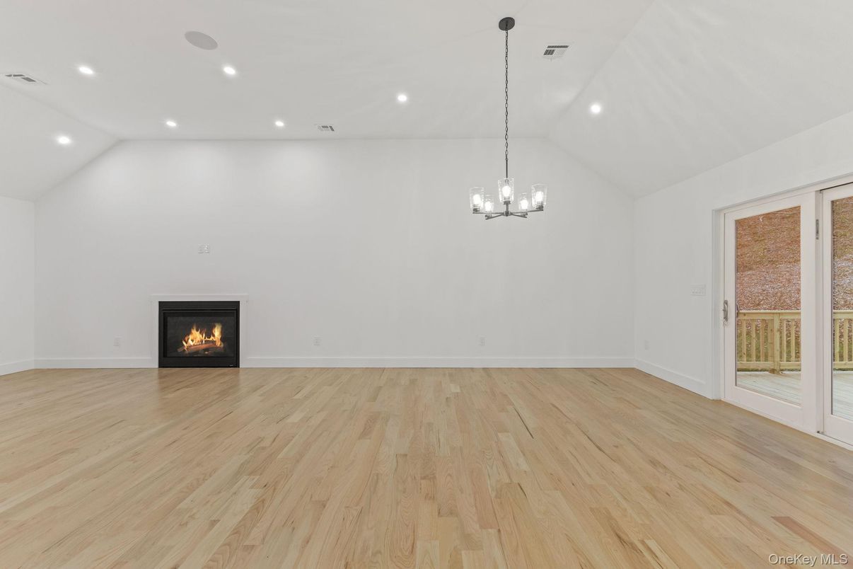 Chandelier, Empty room, Fireplace, Interior, Recessed Lighting, Wood Texture Flooring