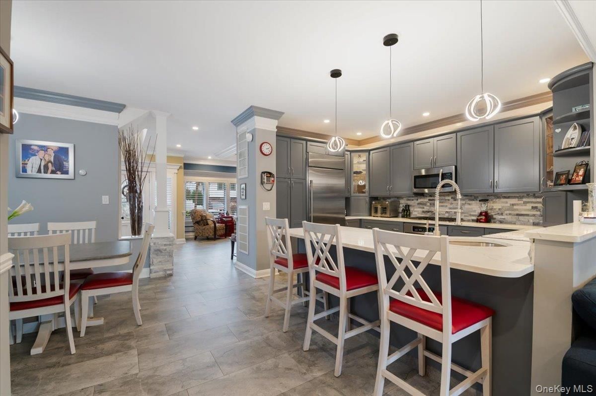 Dining room, Interior, Kitchen, Pendant Lights, Recessed Lighting, Stainless Steel Appliances, Wood Texture Flooring