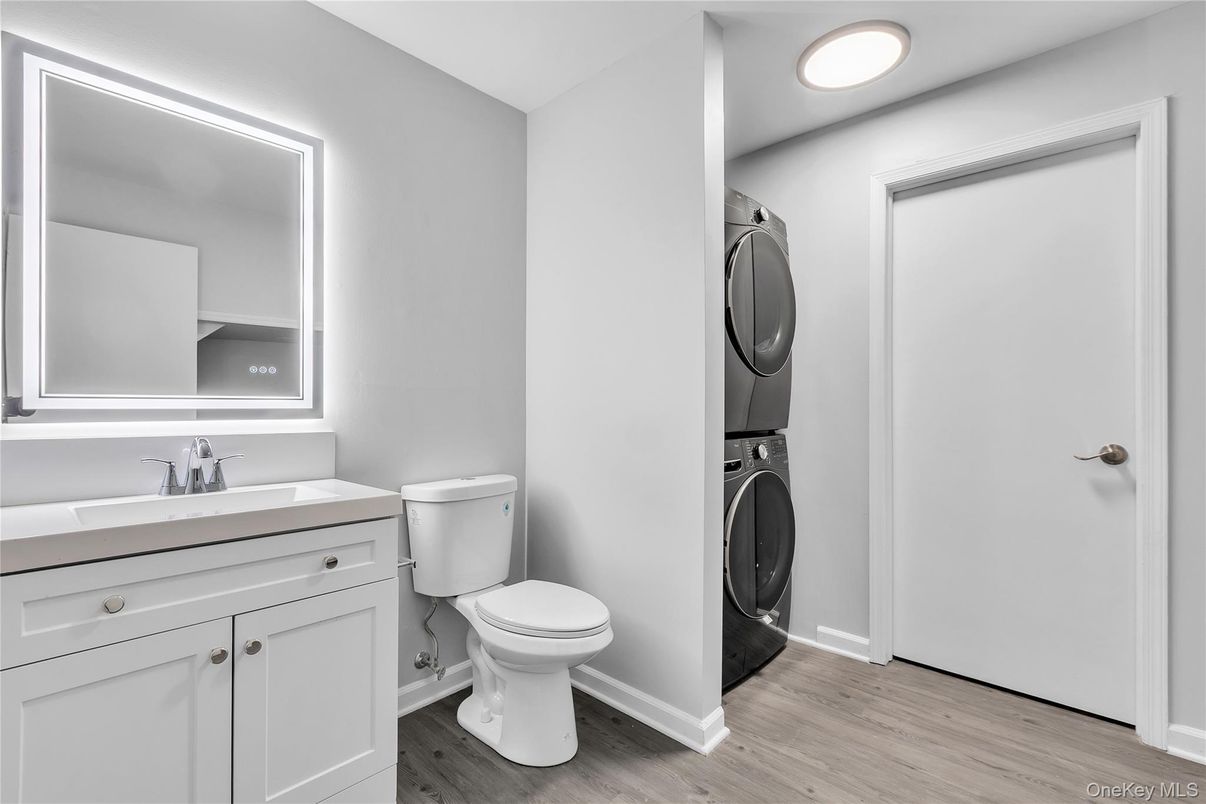 Bathroom, Interior, Recessed Lighting, Utility Closets, Washer, Wood Texture Flooring
