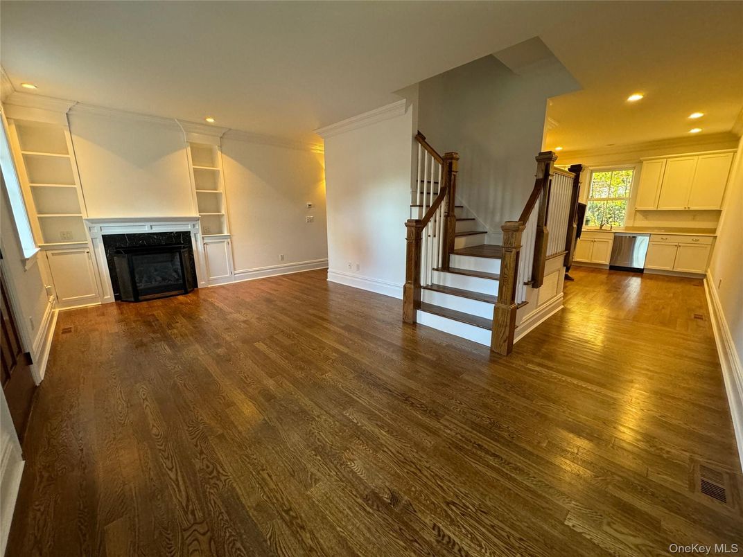 Empty room, Fireplace, Interior, Kitchen, Recessed Lighting, Wood Texture Flooring