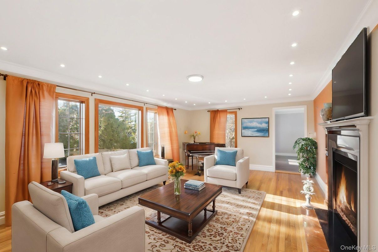 Fireplace, Interior, Living room, Piano, Recessed Lighting, Wood Texture Flooring