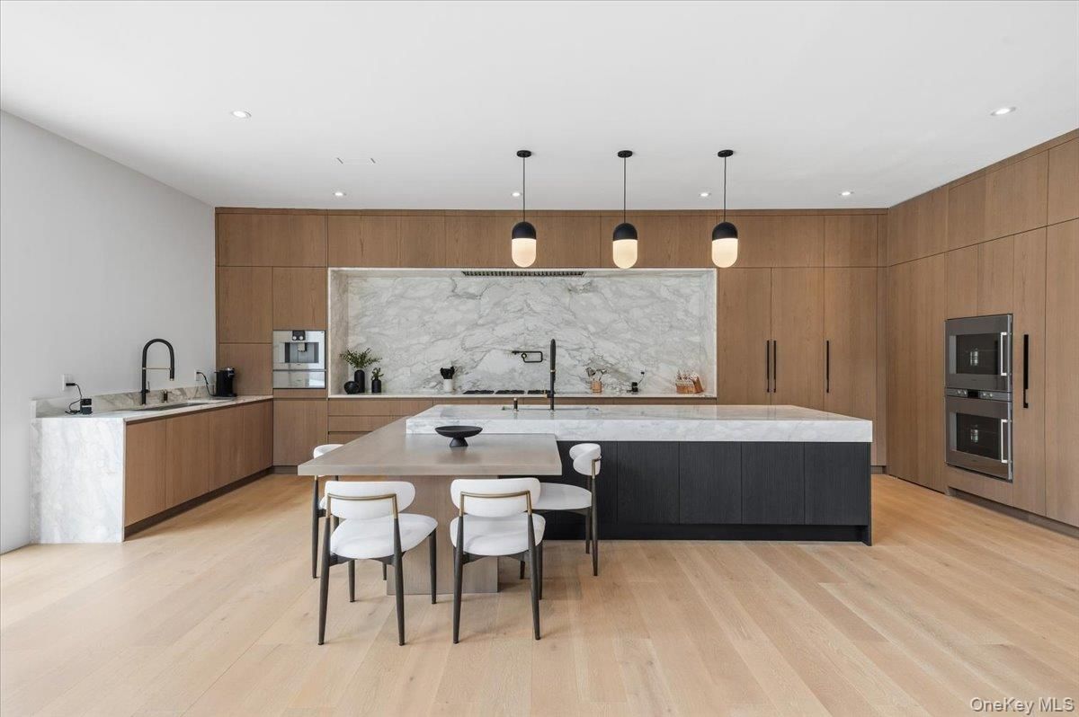 Interior, Kitchen, Marble Walls, Pendant Lights, Recessed Lighting, Stainless Steel Appliances, Wood Texture Flooring