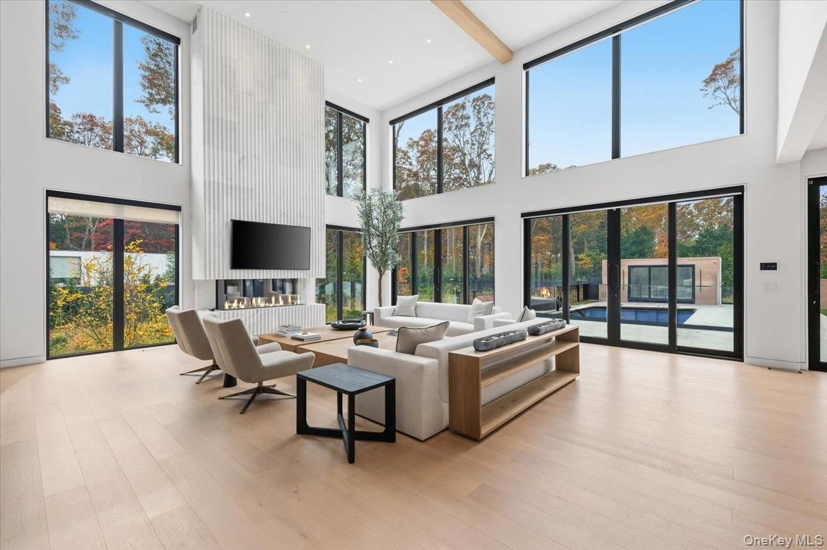 Fireplace, Interior, Living room, Recessed Lighting, Sun Room, Wood Texture Flooring