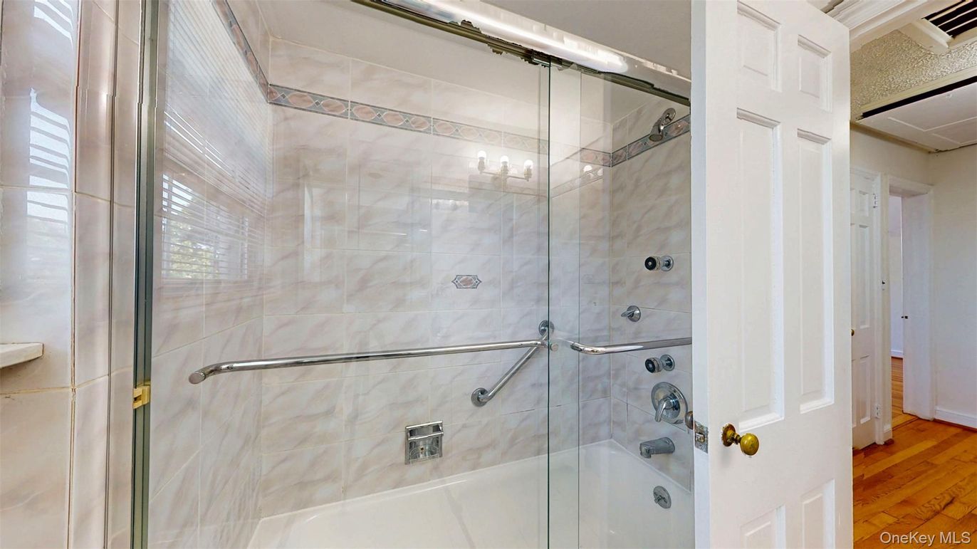 Bathroom, Glass Shower, Interior, Marble Walls, Wood Texture Flooring