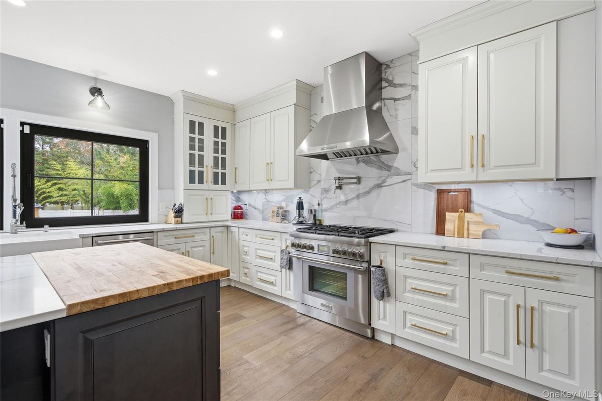 Interior, Kitchen, Marble Walls, Recessed Lighting, Stainless Steel Appliances, Wood Texture Flooring