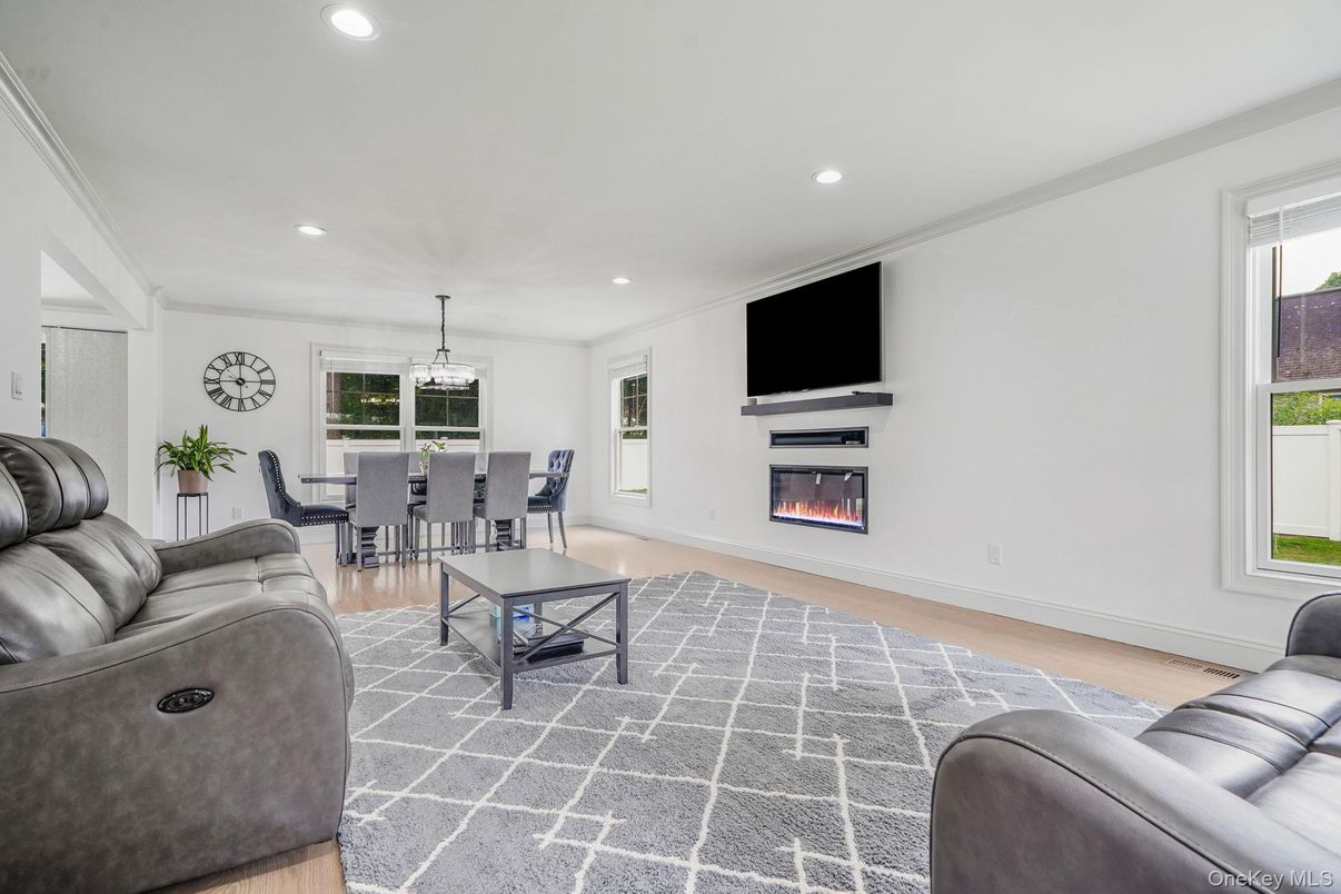 Dining room, Fireplace, Interior, Living room, Pendant Lights, Recessed Lighting, Wood Texture Flooring