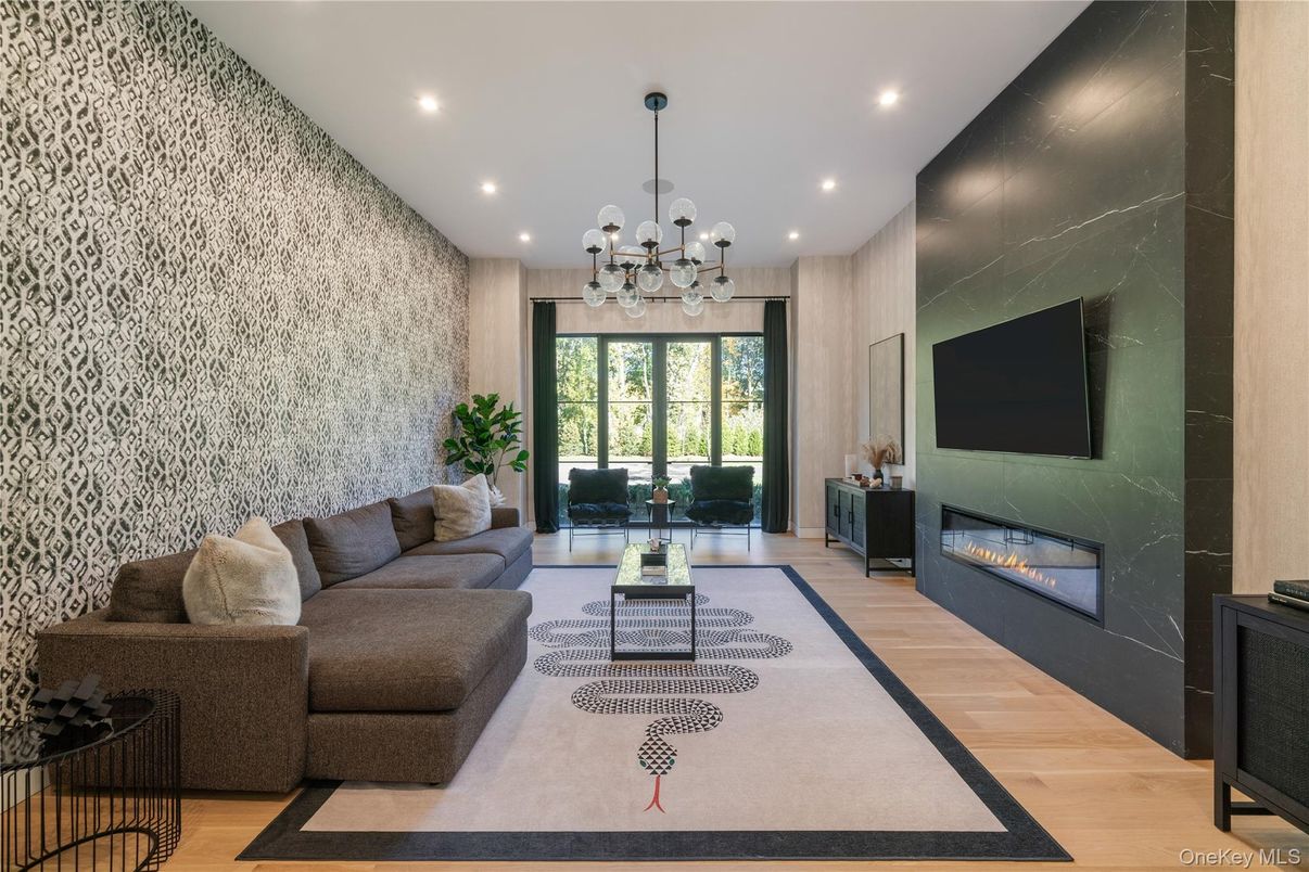 Fireplace, Interior, Living room, Marble Walls, Pendant Lights, Recessed Lighting, Wood Texture Flooring