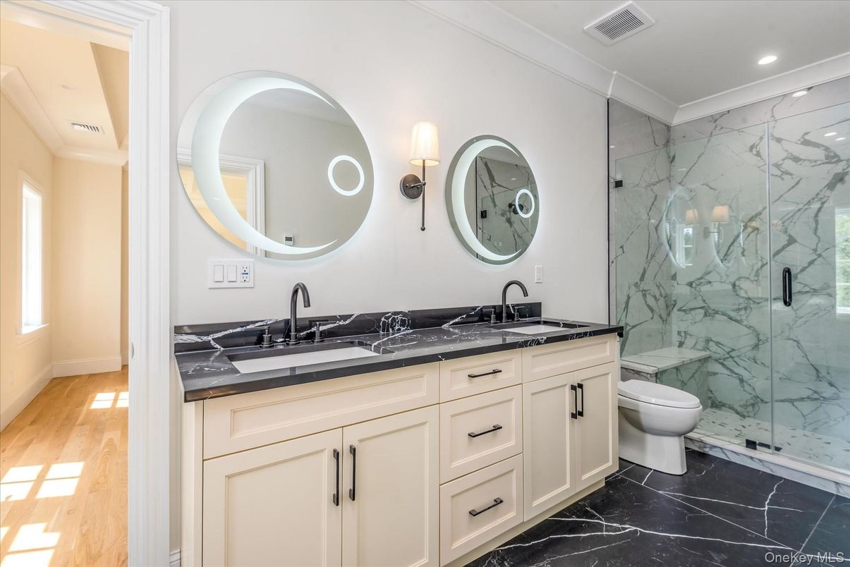 Bathroom, Dual Sink Vanities, Glass Shower, Interior, Marble, Marble Walls, Recessed Lighting