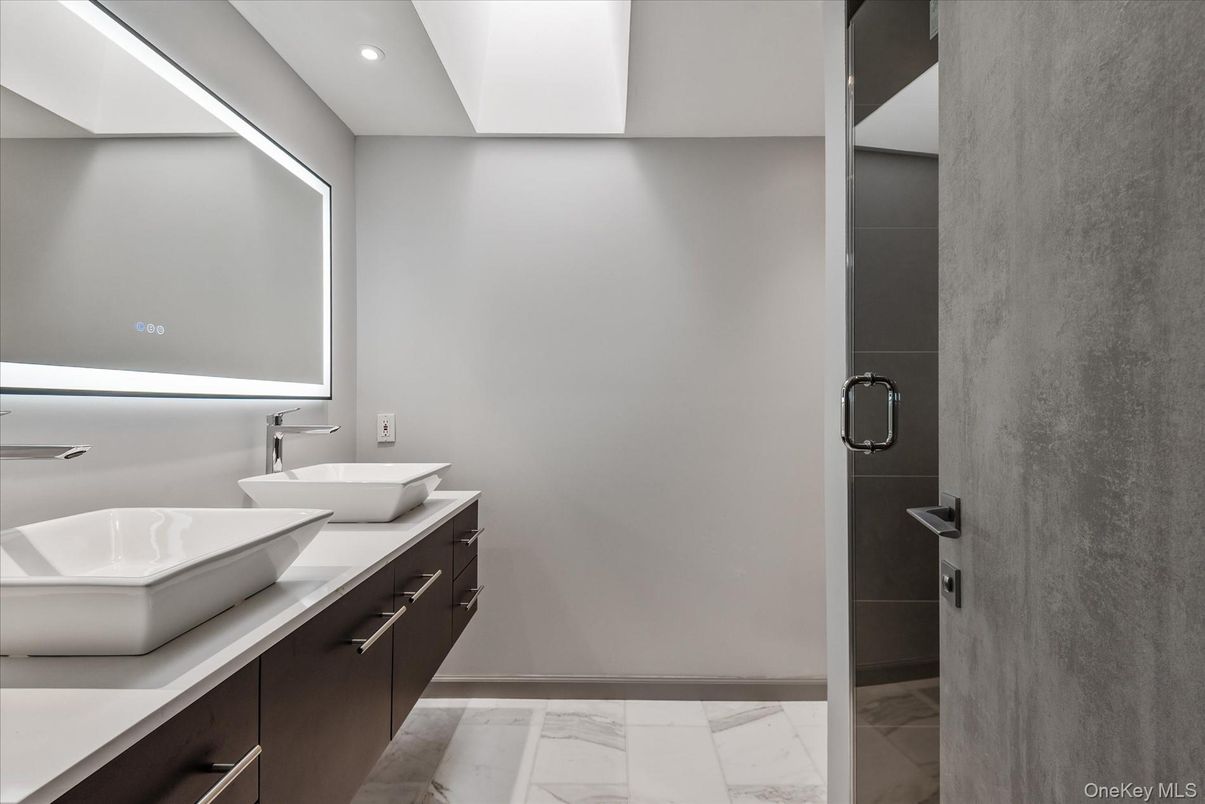 Bathroom, Dual Sink Vanities, Glass Shower, Interior, Marble, Recessed Lighting