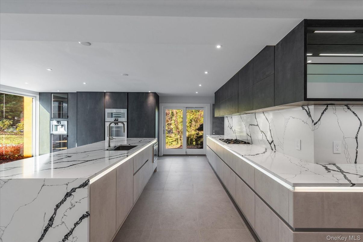 Interior, Kitchen, Marble Walls, Recessed Lighting, Stainless Steel Appliances