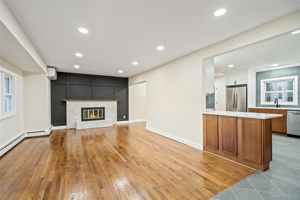 Fireplace, Interior, Kitchen, Recessed Lighting, Stainless Steel Appliances, Wood Texture Flooring