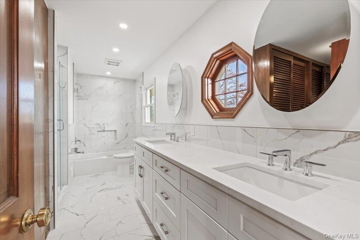 Bathroom, Dual Sink Vanities, Interior, Marble, Marble Walls, Recessed Lighting
