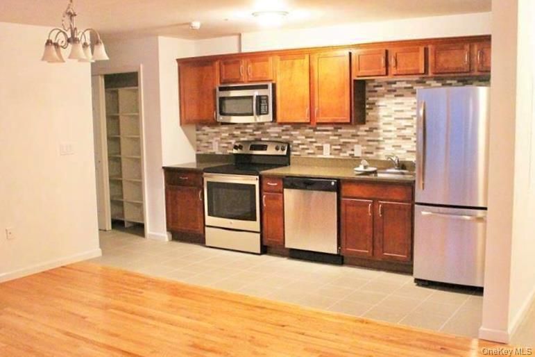 Interior, Kitchen, Pendant Lights, Stainless Steel Appliances, Stone Walls, Wood Texture Flooring