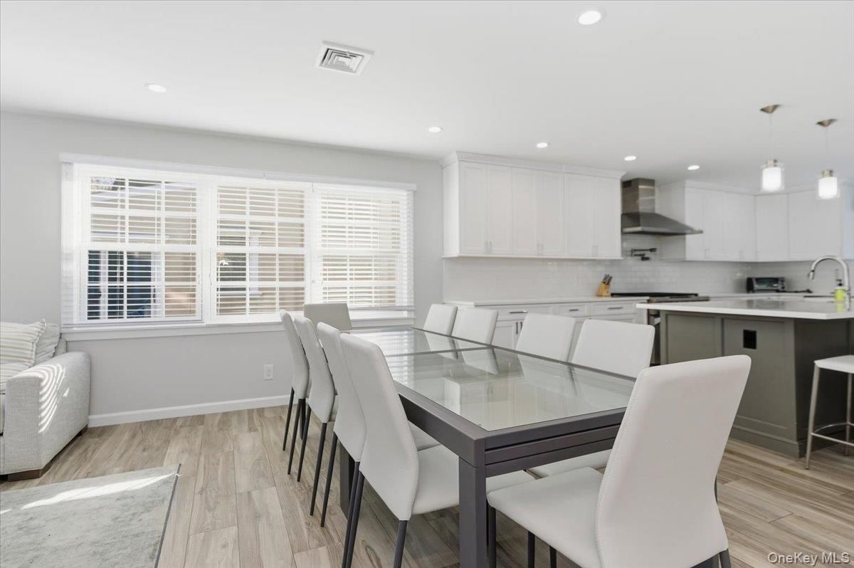 Dining room, Interior, Kitchen, Pendant Lights, Recessed Lighting, Stainless Steel Appliances, Wood Texture Flooring