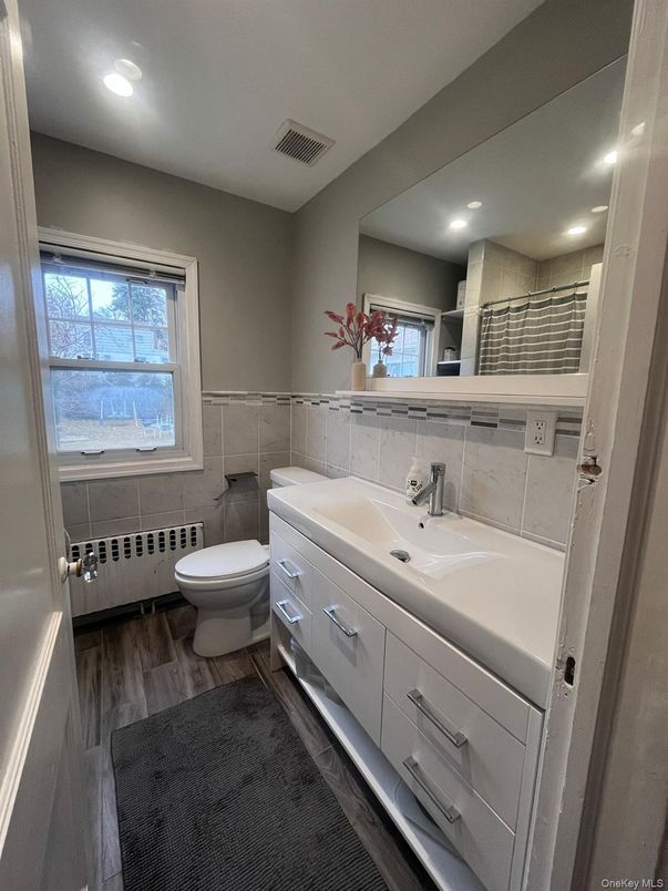 Bathroom, Dual Sink Vanities, Interior, Recessed Lighting, Wood Texture Flooring