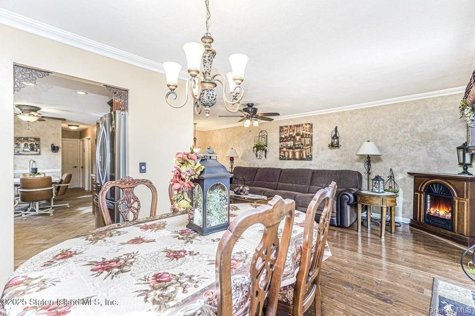 Chandelier, Dining room, Fireplace, Interior, Living room, Recessed Lighting, Wood Texture Flooring