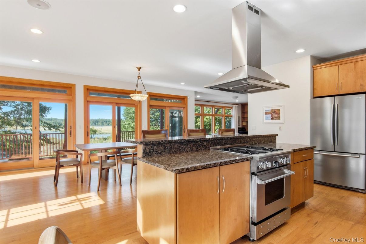 Dining room, Interior, Kitchen, Pendant Lights, Recessed Lighting, Stainless Steel Appliances, Wood Texture Flooring
