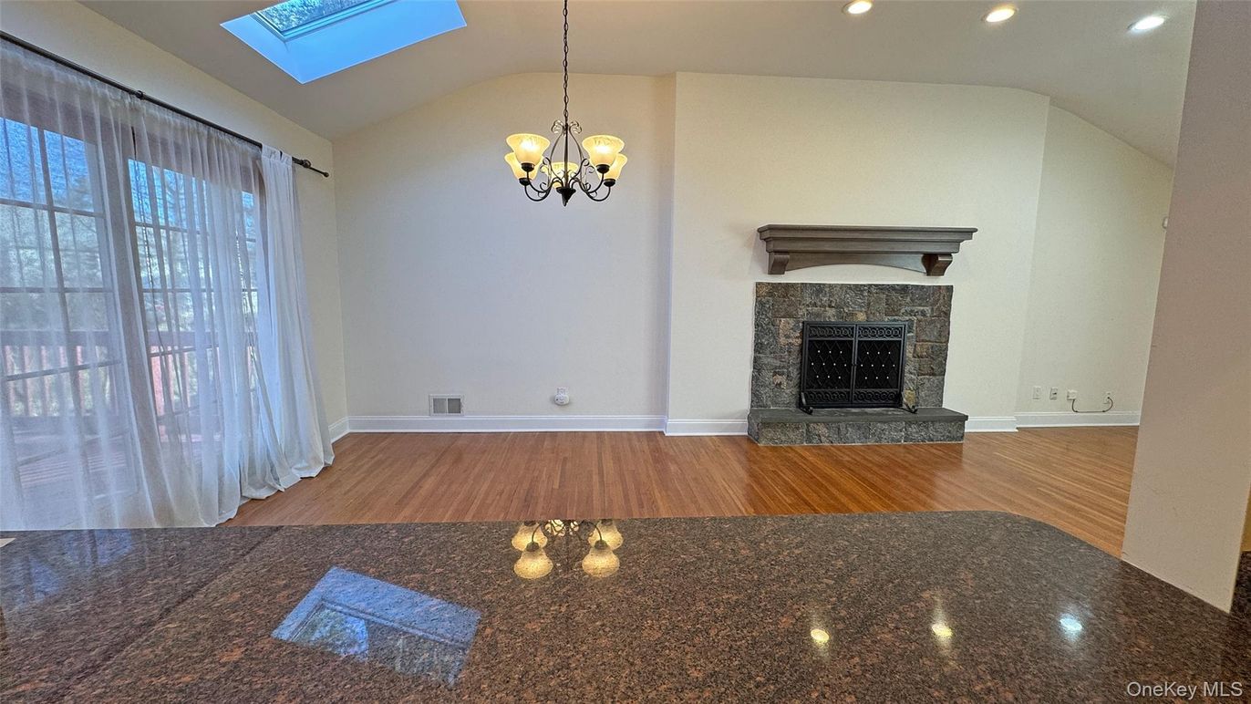 Chandelier, Empty room, Fireplace, Interior, Recessed Lighting, Wood Texture Flooring