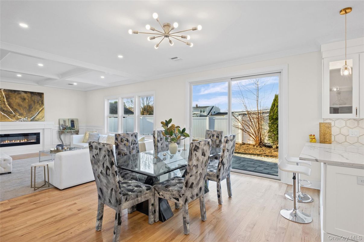 Dining room, Fireplace, Interior, Living room, Pendant Lights, Recessed Lighting, Wood Texture Flooring