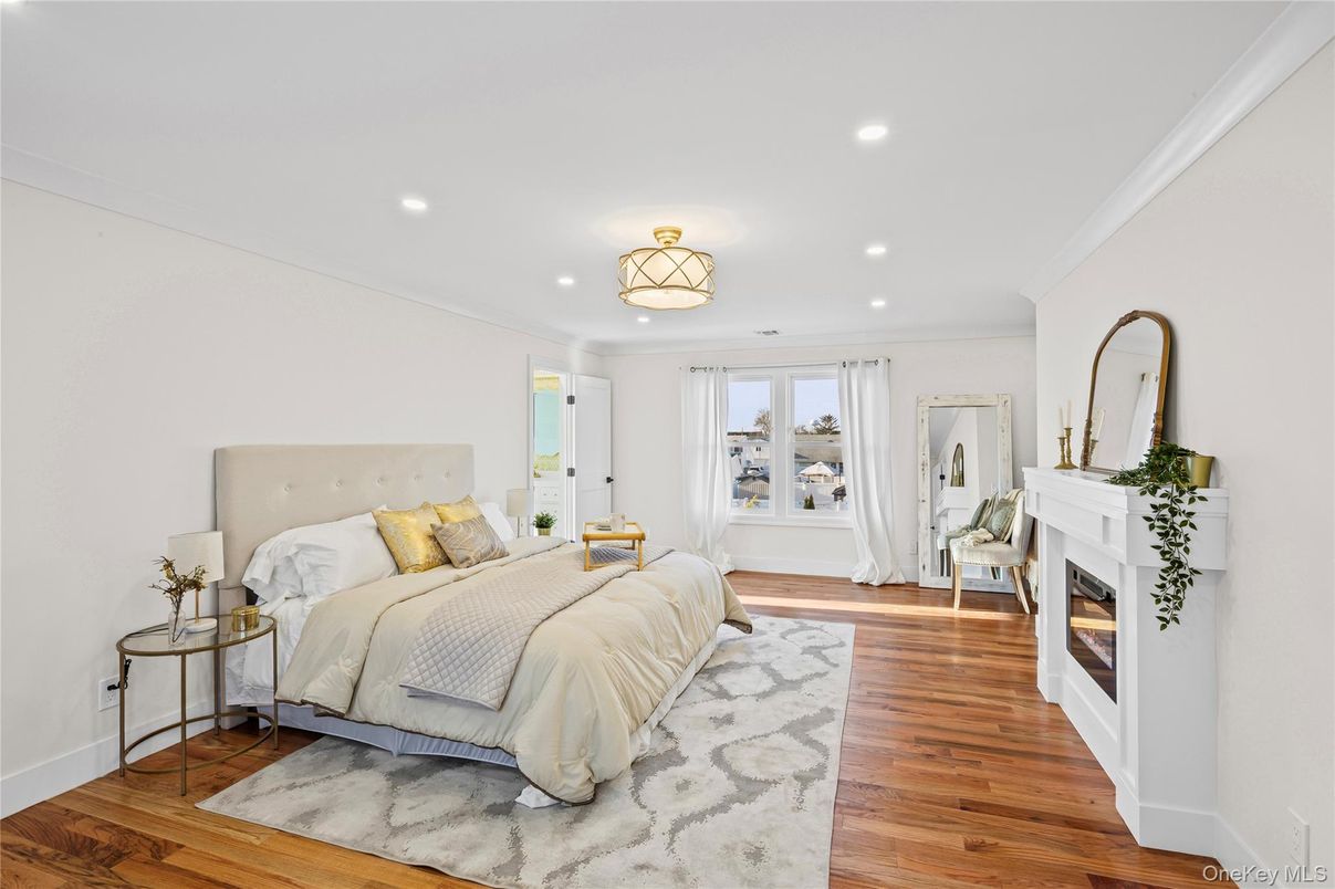 Bedroom, Fireplace, Interior, Recessed Lighting, Wood Texture Flooring