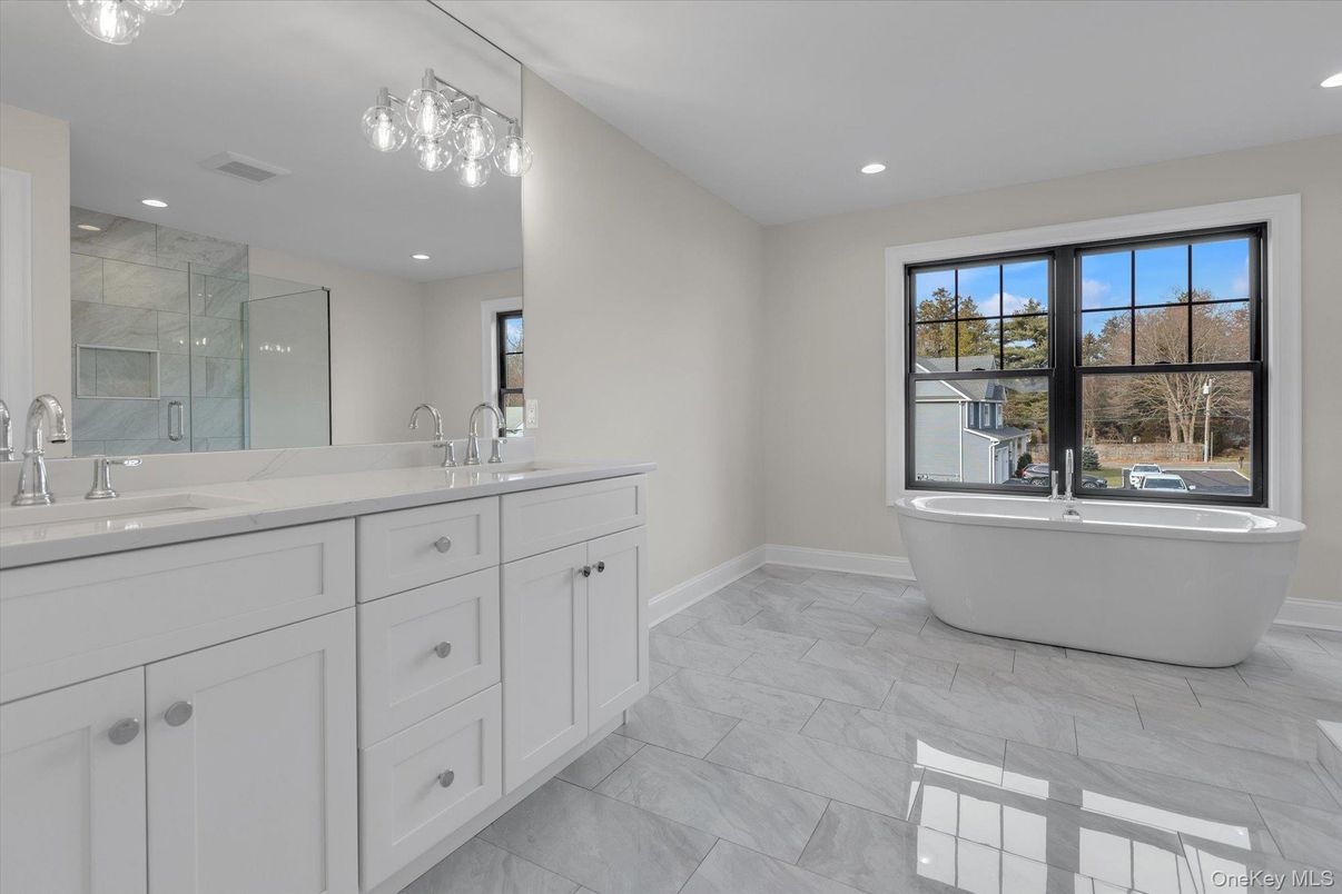 Bathroom, Dual Sink Vanities, Free Standing Baths, Glass Shower, Interior, Marble, Marble Walls, Recessed Lighting