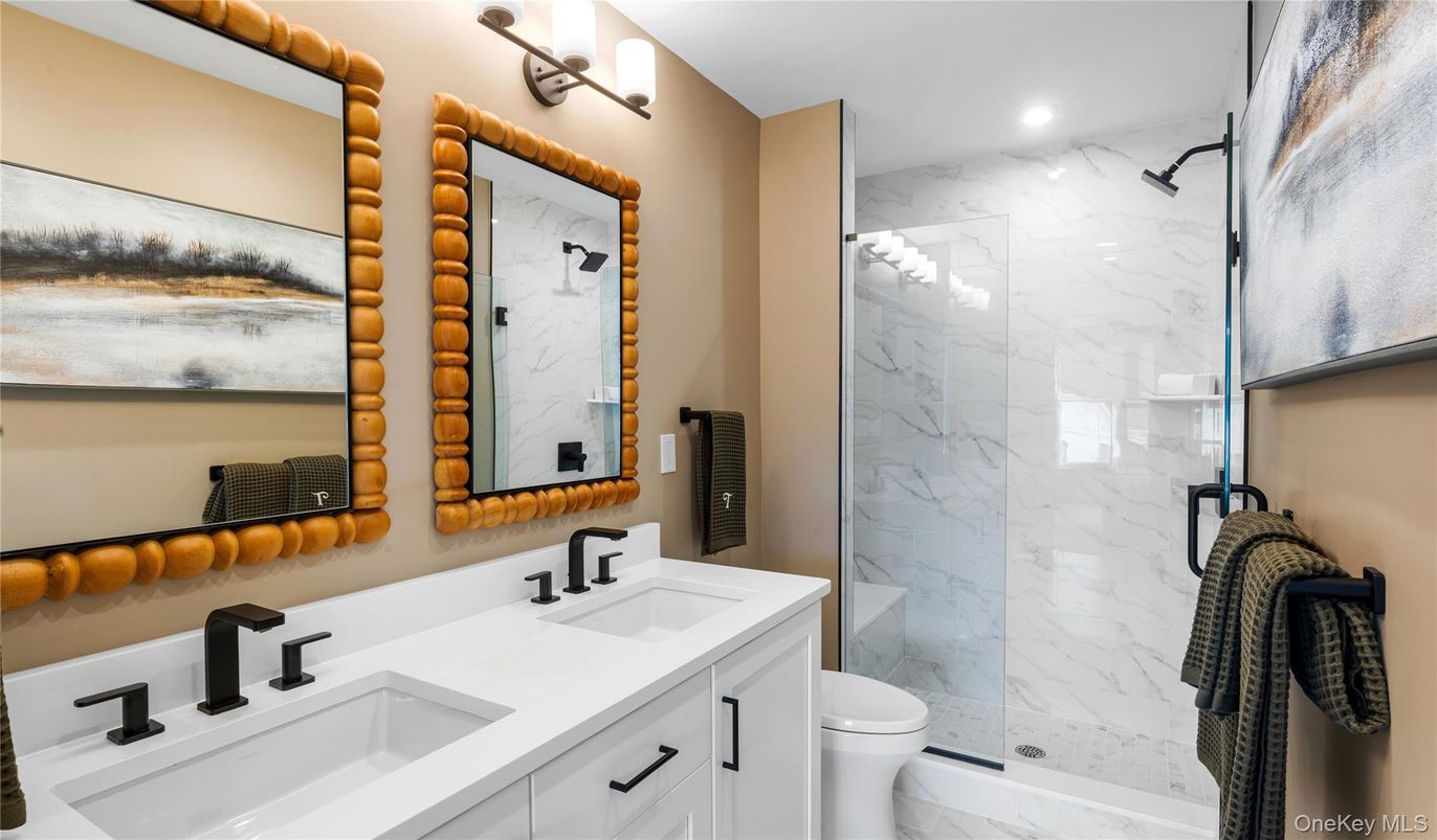 Bathroom, Dual Sink Vanities, Glass Shower, Interior, Marble, Marble Walls, Recessed Lighting