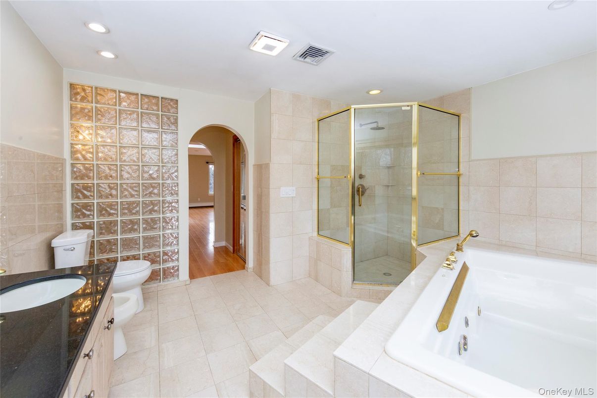 Bathroom, Dual Sink Vanities, Glass Shower, Interior, Recessed Lighting, Wood Texture Flooring