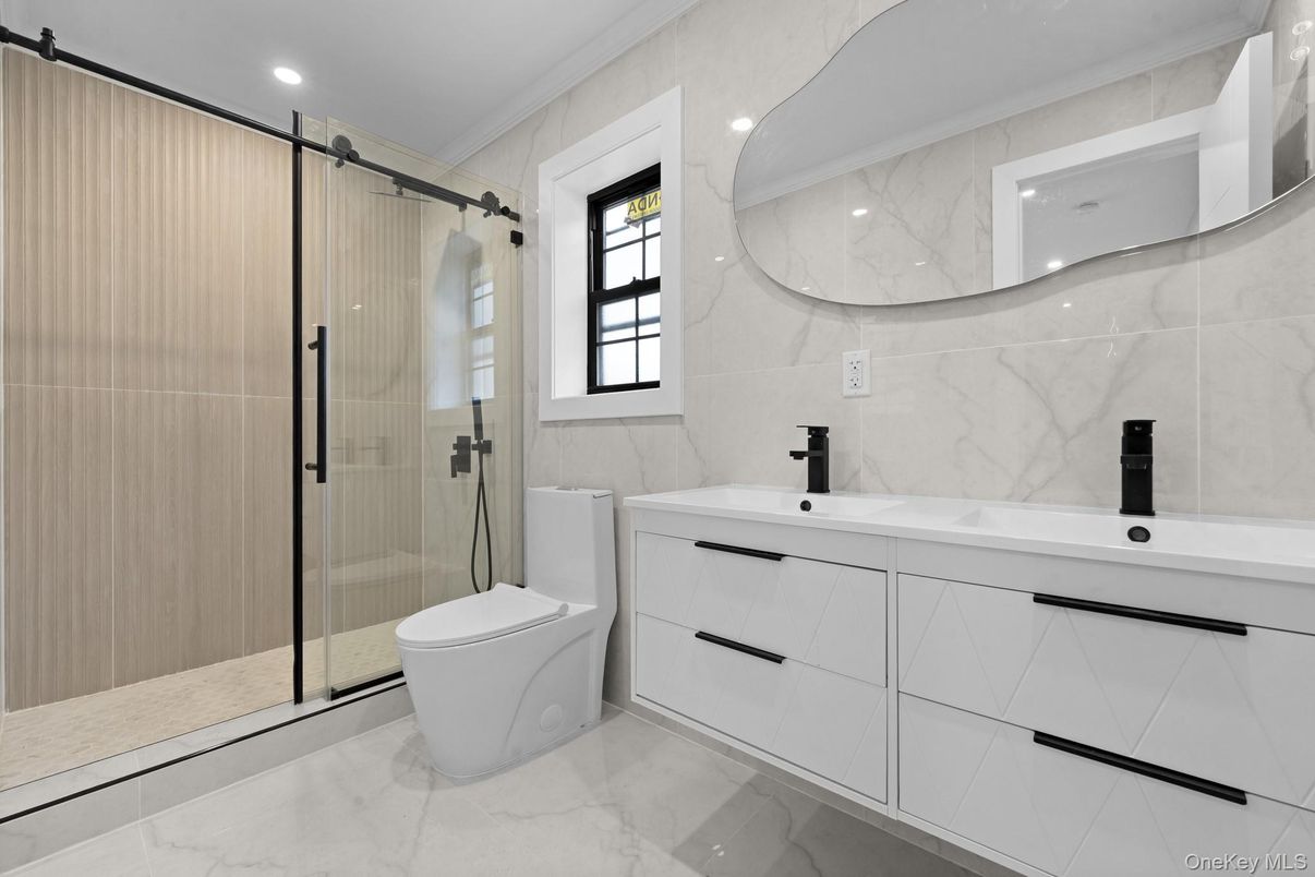 Bathroom, Dual Sink Vanities, Glass Shower, Interior, Marble, Marble Walls, Recessed Lighting
