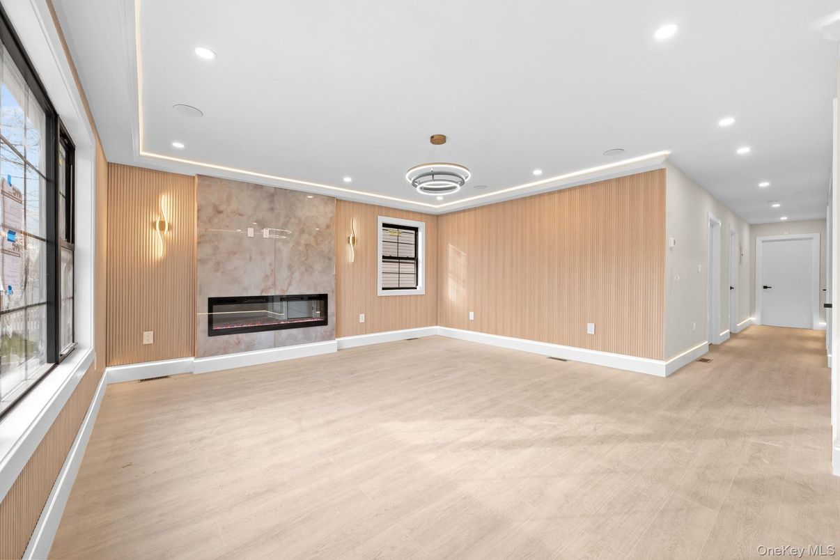 Empty room, Fireplace, Interior, Pendant Lights, Recessed Lighting, Wood Texture Flooring, Wooden Walls