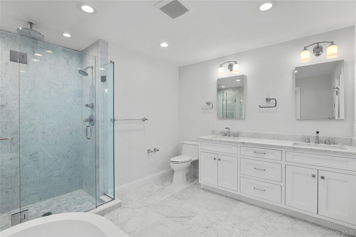 Bathroom, Dual Sink Vanities, Glass Shower, Interior, Marble, Marble Walls, Recessed Lighting
