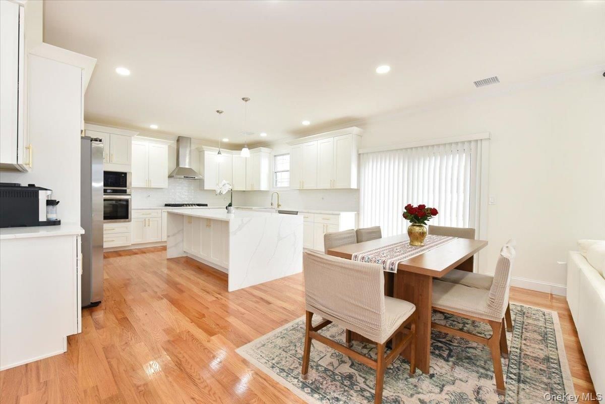 Dining room, Interior, Kitchen, Pendant Lights, Recessed Lighting, Stainless Steel Appliances, Wood Texture Flooring