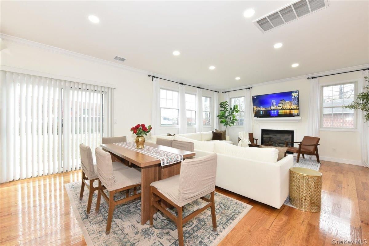 Dining room, Fireplace, Interior, Living room, Recessed Lighting, Wood Texture Flooring