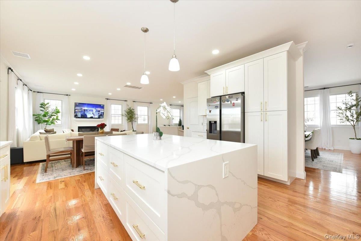 Dining room, Interior, Kitchen, Living room, Pendant Lights, Recessed Lighting, Stainless Steel Appliances, Wood Texture Flooring