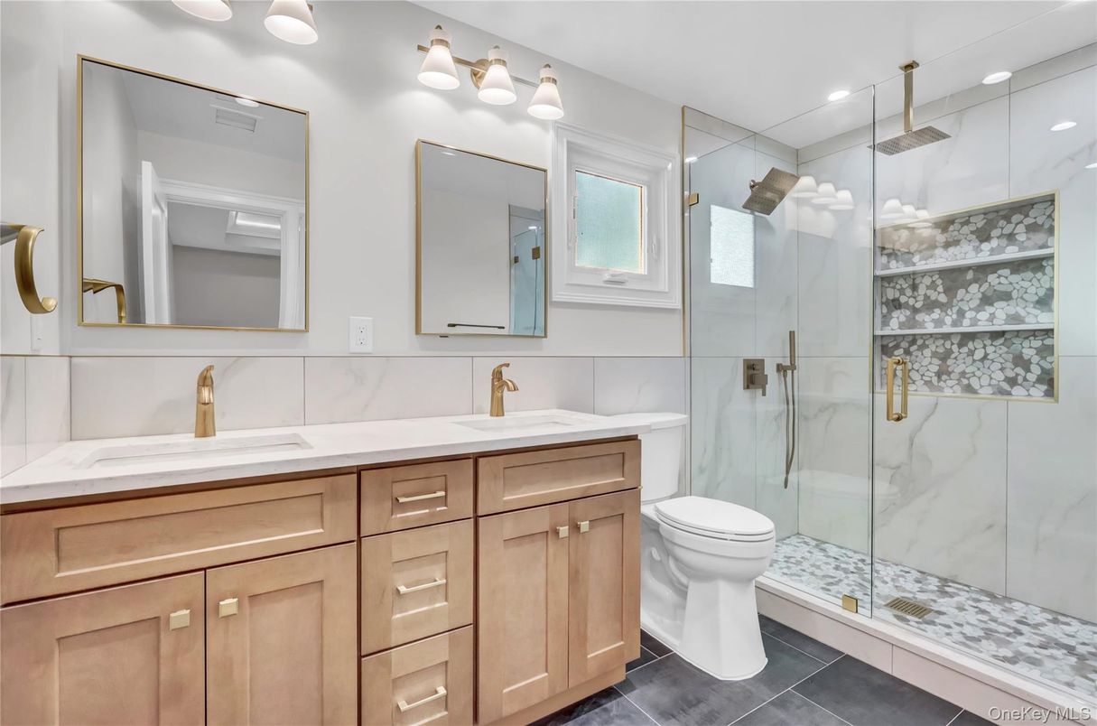 Bathroom, Dual Sink Vanities, Glass Shower, Interior, Marble Walls, Recessed Lighting