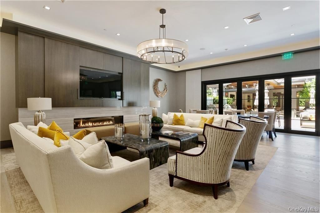 Chandelier, Dining room, Fireplace, Interior, Living room, Pendant Lights, Recessed Lighting, Wood Texture Flooring