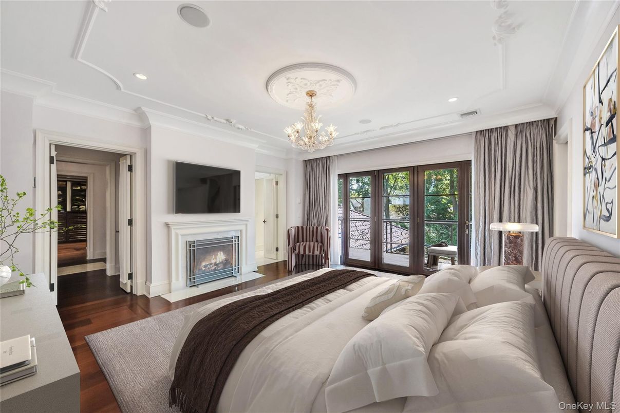Bedroom, Chandelier, Fireplace, Interior, Recessed Lighting, Wood Texture Flooring