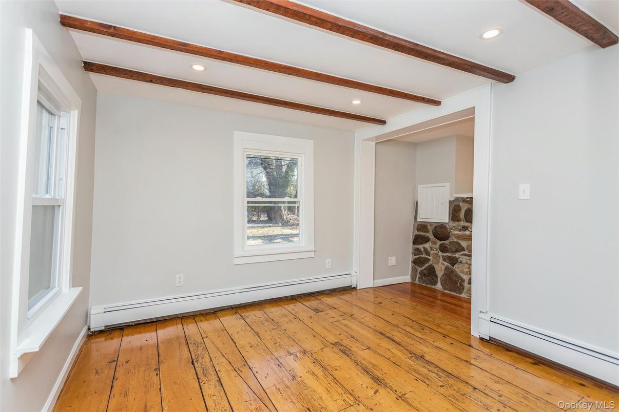 Empty room, Fireplace, Interior, Recessed Lighting, Stone Walls, Wooden Beams, Wood Texture Flooring