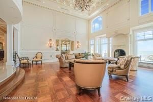 Chandelier, Fireplace, Interior, Living room, Recessed Lighting, Water, Wood Texture Flooring