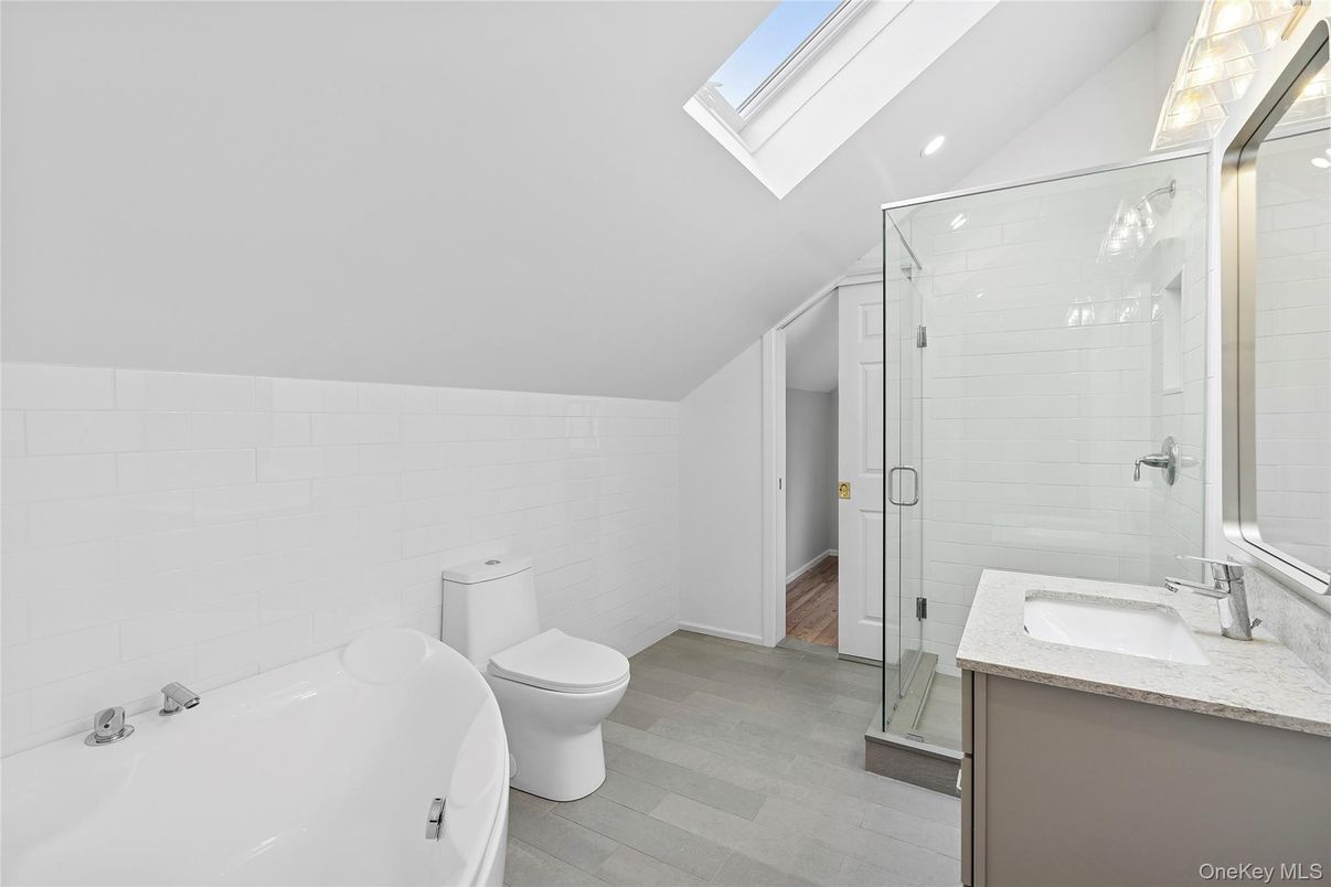 Bathroom, Dual Sink Vanities, Glass Shower, Interior, Recessed Lighting, Wood Texture Flooring