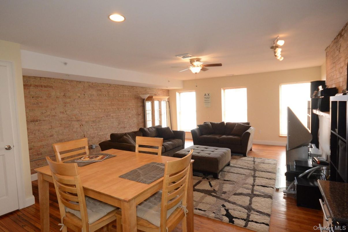 Dining room, Interior, Living room, Recessed Lighting, Stone Walls, Wood Texture Flooring
