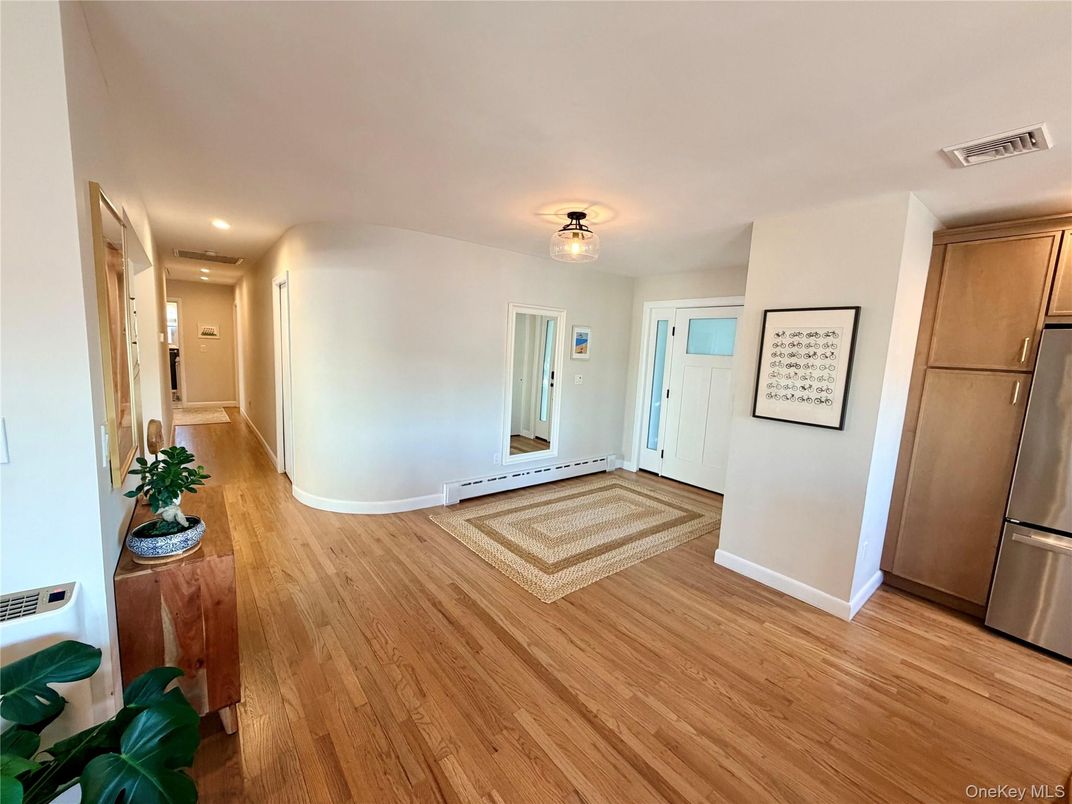 Empty room, Interior, Kitchen, Recessed Lighting, Stainless Steel Appliances, Wood Texture Flooring